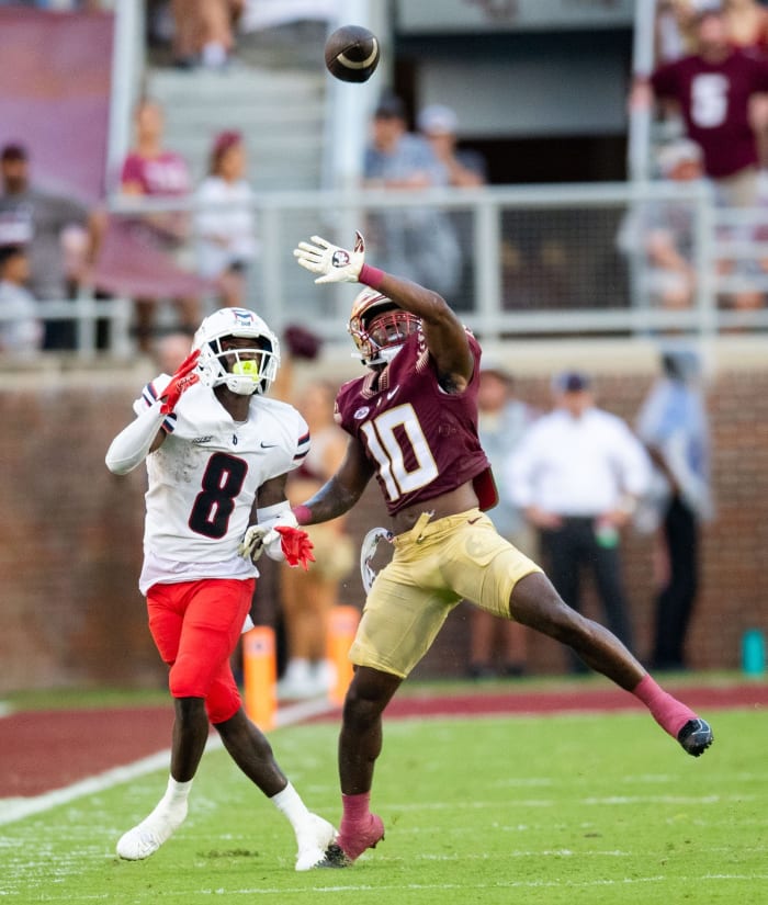 Florida State defensive back Jammie Robinson (10) leaps in front of his opponent to try to intercept the ball. The Florida State Seminoles hosted the Duquesne Dukes at Doak Campbell Stadium on Saturday, Aug. 27, 2022. | Alicia Devine/Tallahassee Democrat / USA TODAY NETWORK
